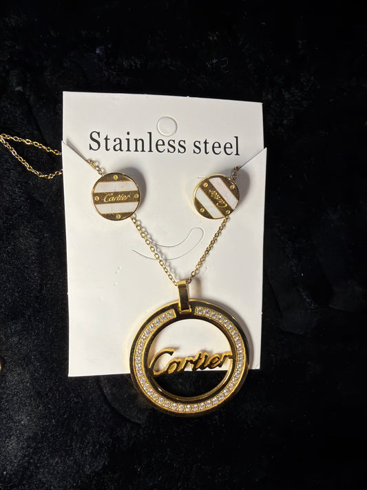 Cartier necklace set 

gold-tone Cartier-style pendant necklace featuring mother-of-pearl accents and diamond simulants.