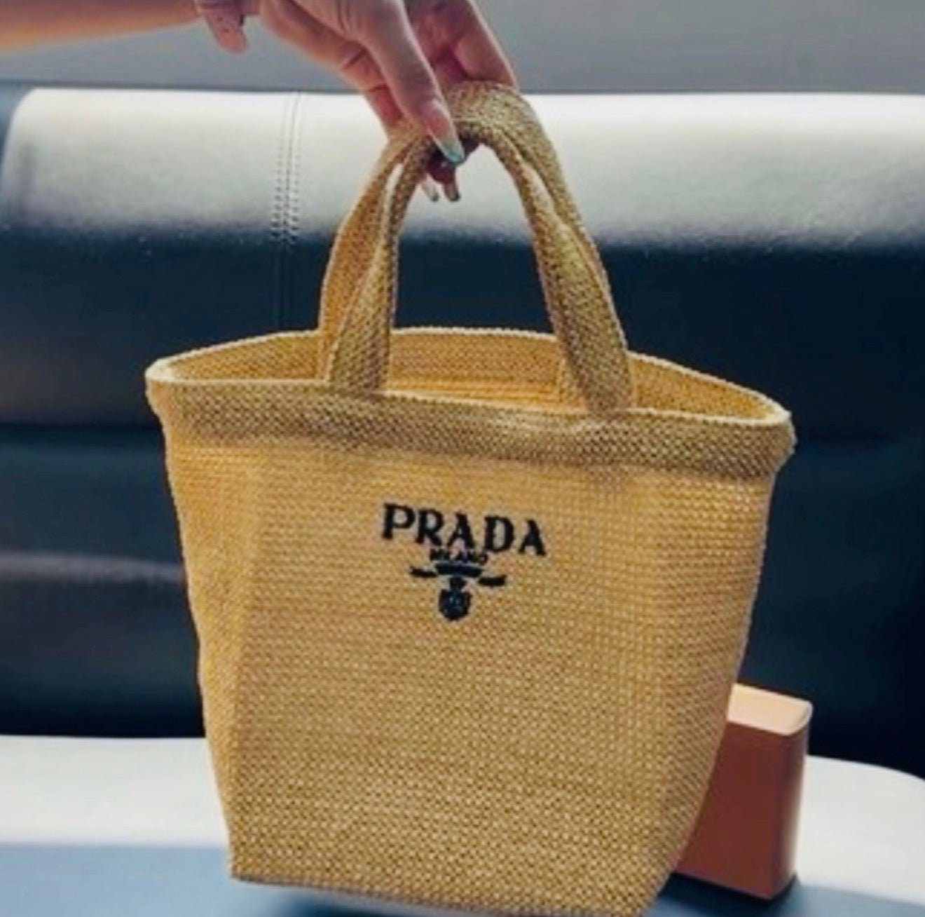 Prada tan woven bag small