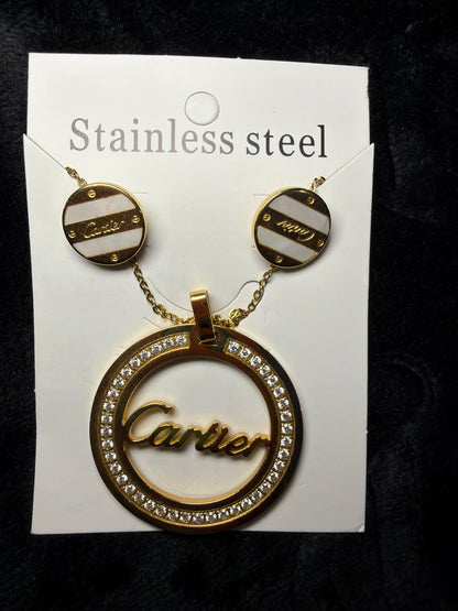 Cartier necklace set 

gold-tone Cartier-style pendant necklace featuring mother-of-pearl accents and diamond simulants.